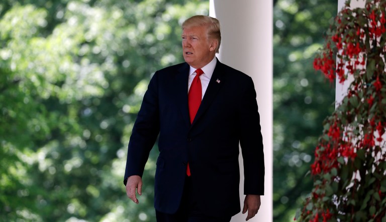 President Donald Trump walks out to speak during a "National Day of Prayer" event in the Rose Garden of the White House, Thursday, May 3, 2018, in Washington.