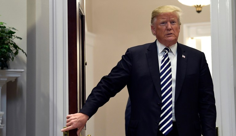 President Donald Trump walks in to the Roosevelt Room of the White House in Washington, Thursday, Nov. 1, 2018, to talk about immigration and border security.