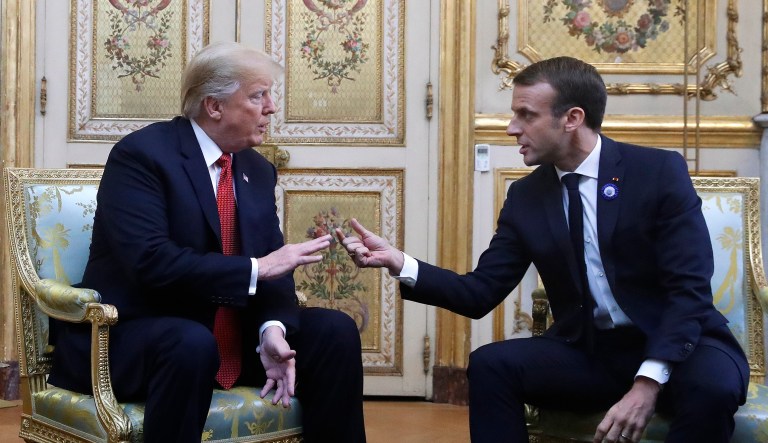 President Donald Trump and French President Emmanuel Macron gesture during their meeting inside the Elysee Palace in Paris Saturday Nov. 10, 2018. Trump is joining other world leaders at centennial commemorations in Paris this weekend to mark the end of World War I.