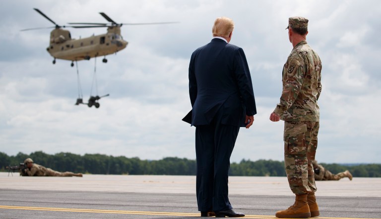 President Trump and Maj. Gen. Walter Piatt view air assault exercises outside Hangar 2060 at Fort Drum, N.Y., Monday, Aug. 13, 2018, before a signing ceremony for H.R. 5515, the "John S. McCain National Defense Authorization Act for Fiscal Year 2019."