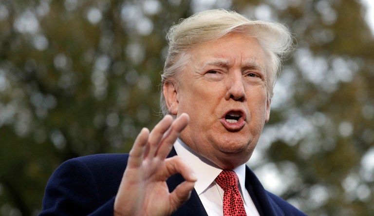 President Donald Trump talks to the media before boarding Marine One on the South Lawn of the White House, Friday, Nov. 9, 2018, in Washington.
