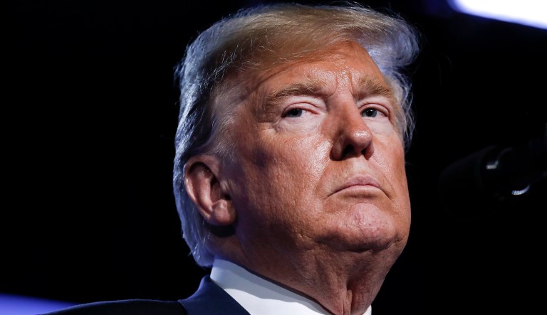 U.S. President Donald Trump listens to a question during a news conference before departing the NATO Summit in Brussels, Belgium, Thursday, July 12, 2018.