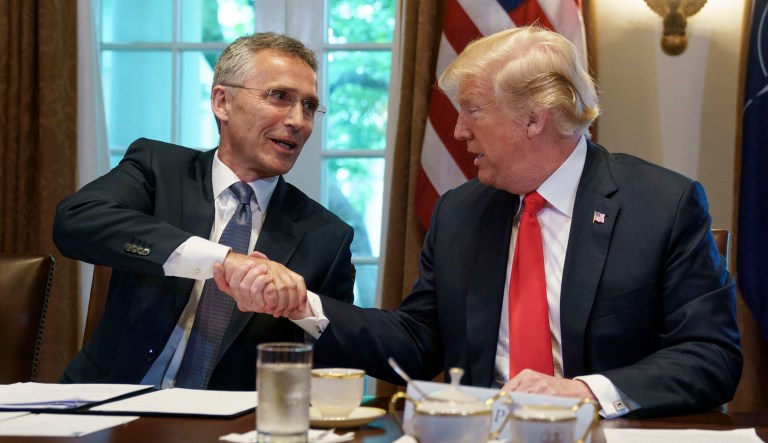 President Donald Trump and NATO Secretary General Jens Stoltenberg shake hands during a expanded bilateral meeting at the White House, in Washington, Thursday, May 17, 2018.