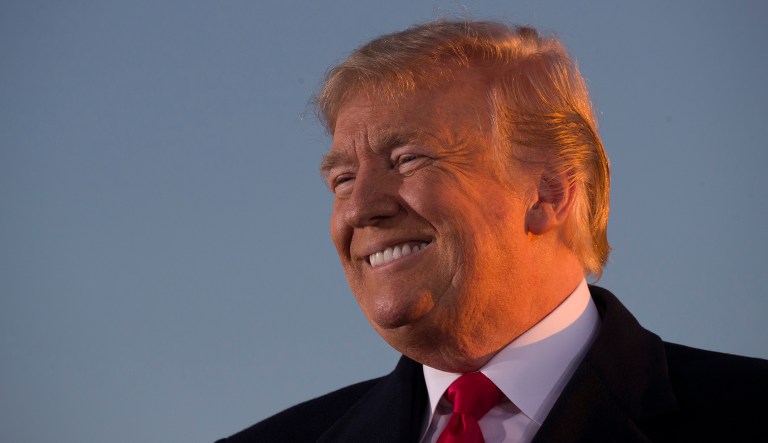 President Donald Trump smiles while speaking during a rally for Sen. Cindy Hyde-Smith, R-Miss., at Tupelo Regional Airport, Monday, Nov. 26, 2018, in Tupelo, Miss.