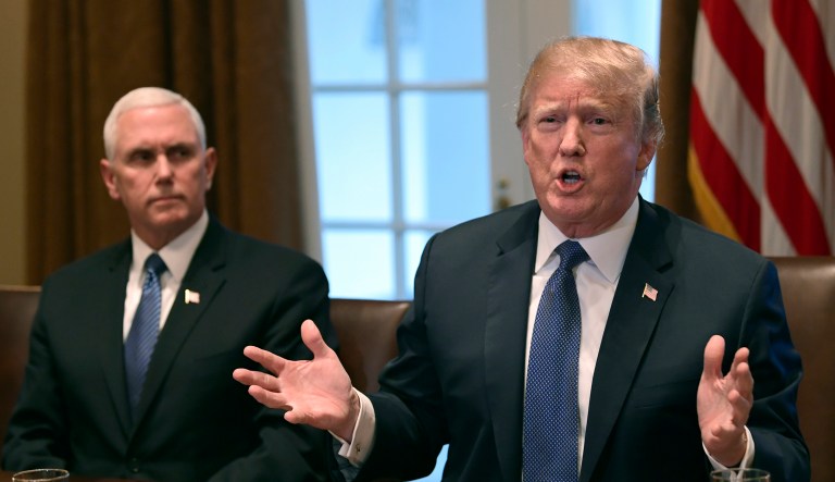 President Donald Trump, right, sitting next to Vice President Mike Pence, left, speaks in the Cabinet Room of the White House in Washington, Monday, April 9, 2018, at the start of a meeting with military leaders.