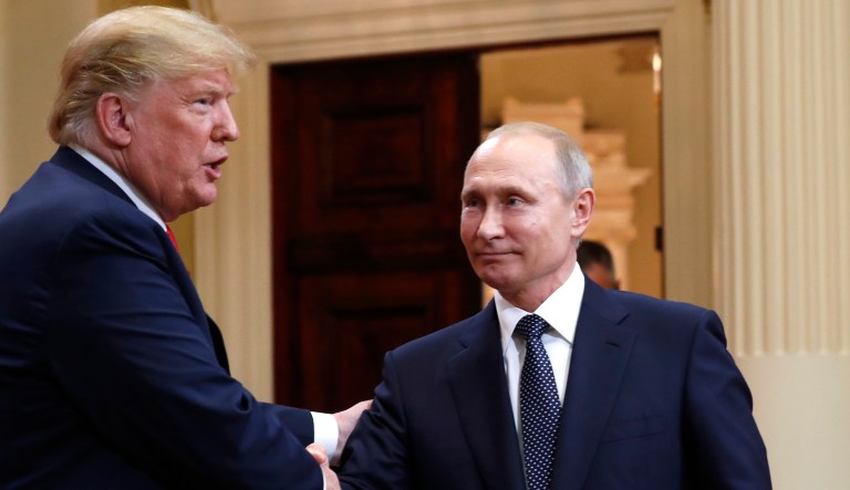 U.S. President Donald Trump, left, bids farewell to Russian President Vladimir Putin at the end of their press conference after their meeting at the Presidential Palace in Helsinki, Finland, Monday, July 16, 2018.