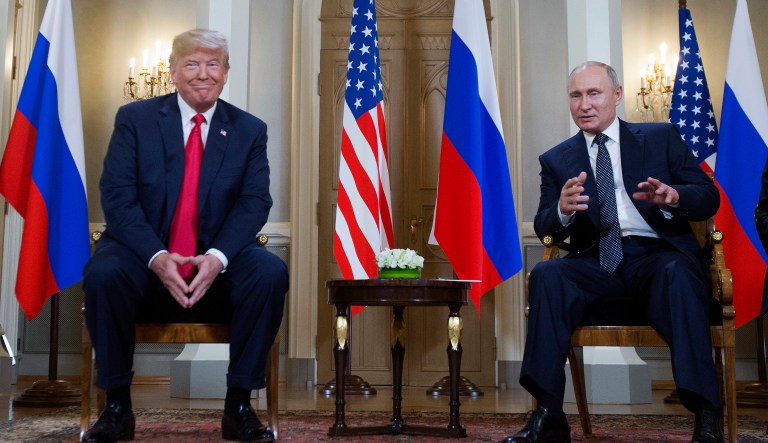 Russian President Vladimir Putin, right, makes a statement as U.S. President Donald Trump, left, looks on at the beginning of a meeting at the Presidential Palace in Helsinki, Finland, Monday, July 16, 2018.