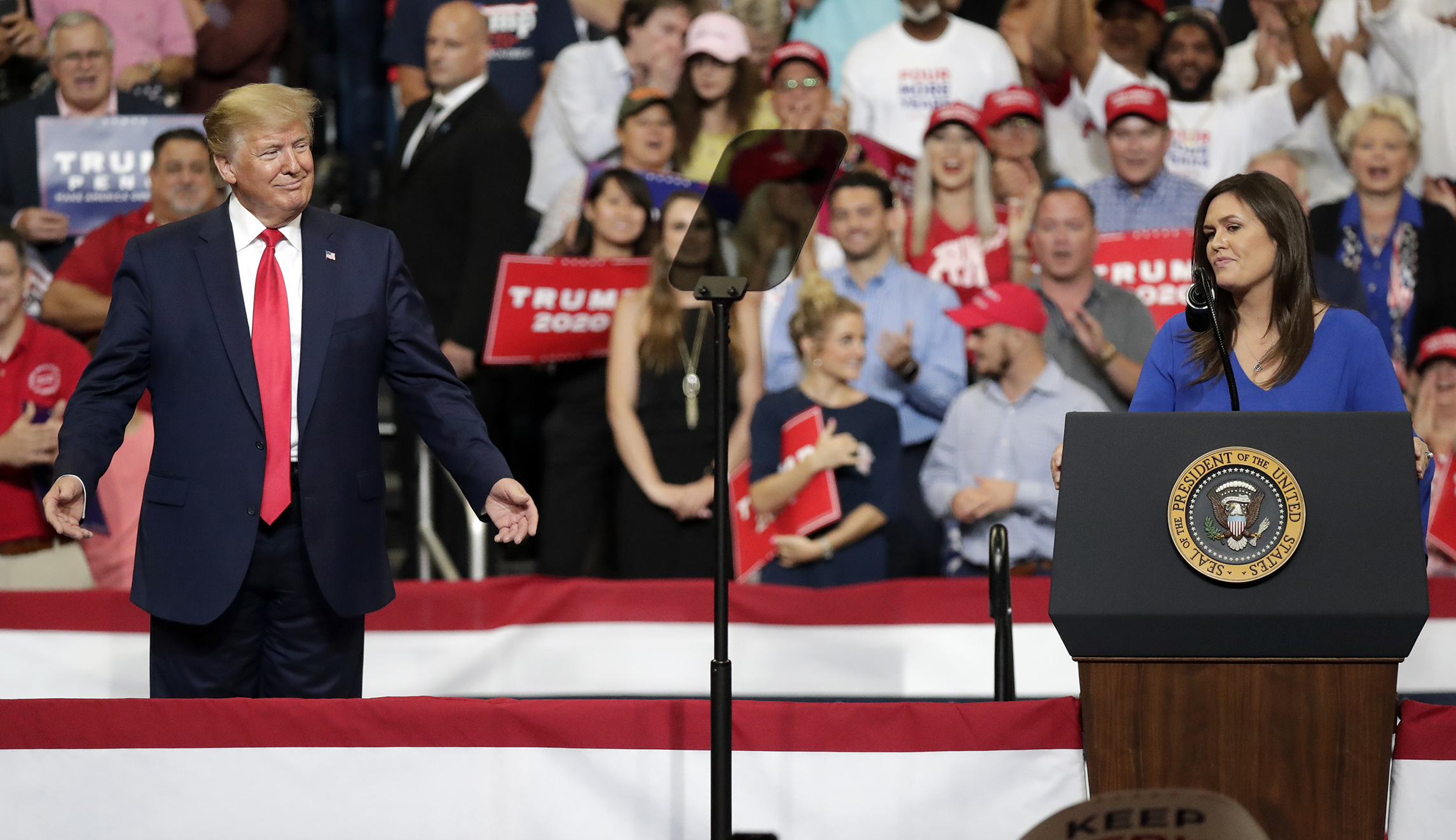 Trump shocks rallygoers when he brings Sarah Sanders on stage for final goodbye