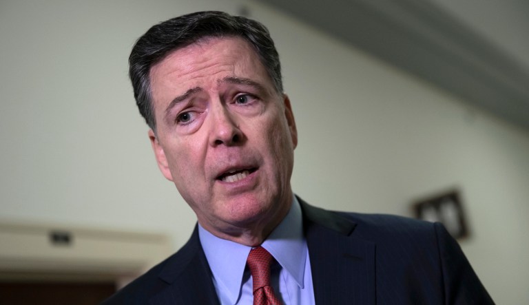 Former FBI Director James Comey speaks to reporters on Capitol Hill, Monday, Dec. 17, 2018.