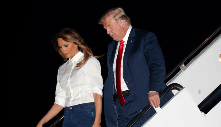 President Donald Trump and first lady Melania Trump walk down the stairs of Air Force One during their arrival, Monday, July 16, 2018, at Andrew Air Force Base, Md. Trump was returning from a weeklong trip to Europe, with stops in Belgium, England, Scotland and Finland.