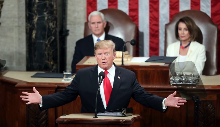 President Donald Trump delivers his State of the Union address to a joint session of Congress on Capitol Hill in Washington, Tuesday, Feb. 4, 2020 as Vice President Mike Pence and House Speaker Nancy Pelosi of Calif., watch.