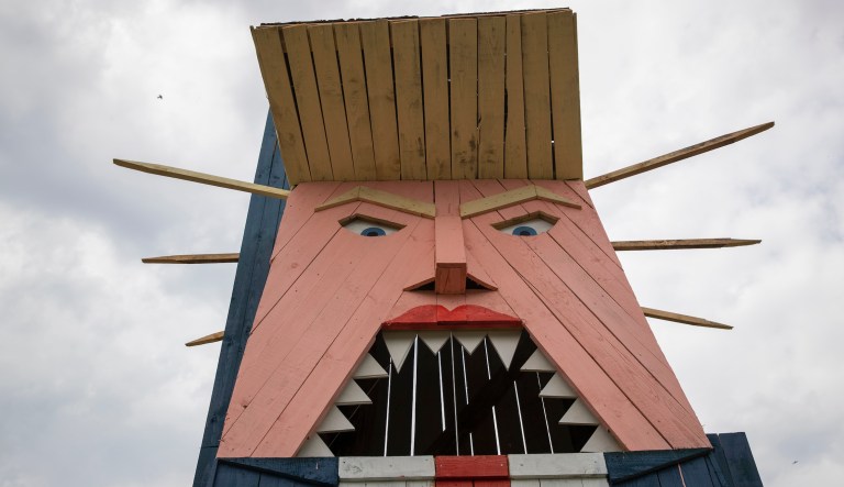 A wooden statue resembling Donald Trump is built near Kamnik, Slovenia, Friday, Aug. 30, 2019. Only weeks after Melania Trump statue was erected in her home town of Sevnica, Slovenia, another statue, now of her husband Donald, has been erected not far from there.