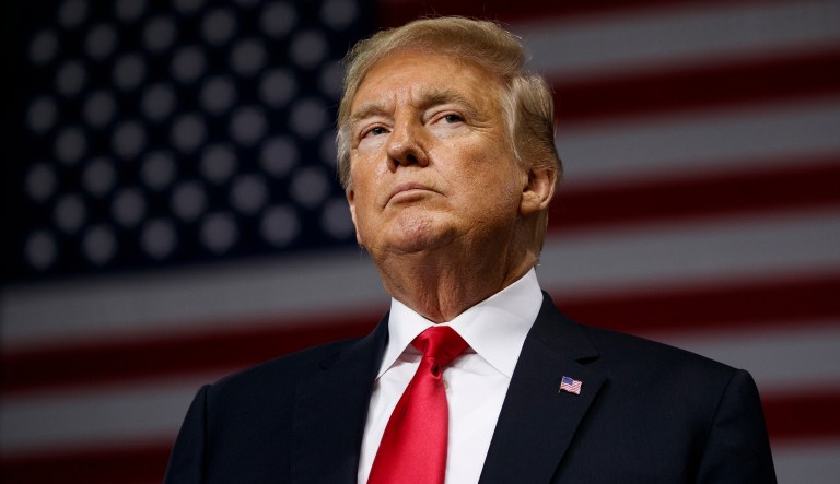 FILE - In this  July 31, 2018, file photo, President Donald Trump pauses during remarks at a campaign rally at Florida State Fairgrounds Expo Hall in Tampa, Fla. The Robesonian paper in Lumberton, N.C., announced itâs dropping an 8-page color comics section from Sunday editions. A newspaper editorial said it cut the comics because of rising newsprint costs spurred by Trump administration tariffs on imported paper. The newspaper says itâs âa decision that we really believe was made at the White House.â