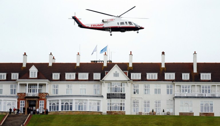 In this Aug. 1, 2015, photo, then-presidential candidate Donald Trump leaves by his helicopter on the third day of the Women's British Open golf championship at the Turnberry golf course in Turnberry, Scotland.