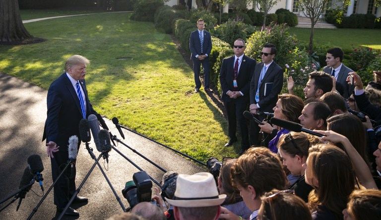 U.S. President Donald Trump speaks to members of the media before boarding Marine One on the South Lawn of the White House in Washington, D.C., U.S., on Friday, Aug. 30, 2019.
