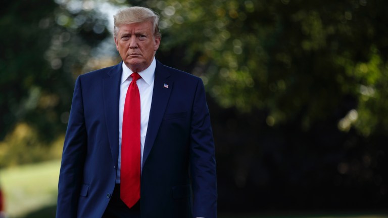 President Donald Trump walks over to speak to reporters before departing for a campaign rally in Cincinnati, on the South Lawn of the White House, Thursday, Aug. 1, 2019, in Washington. 