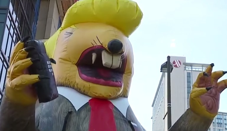 An inflatable balloon of Trump depicted as a rat in Baltimore.
