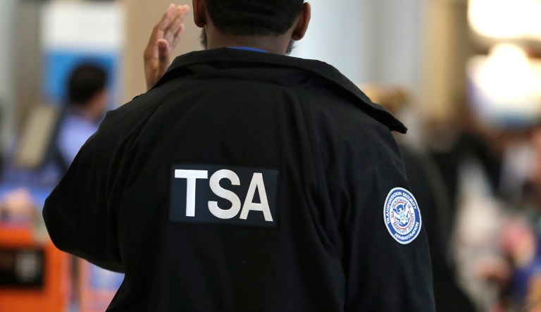 A Transportation Security Administration officer works at a checkpoint at Miami International Airport, Sunday, Jan. 6, 2019, in Miami.