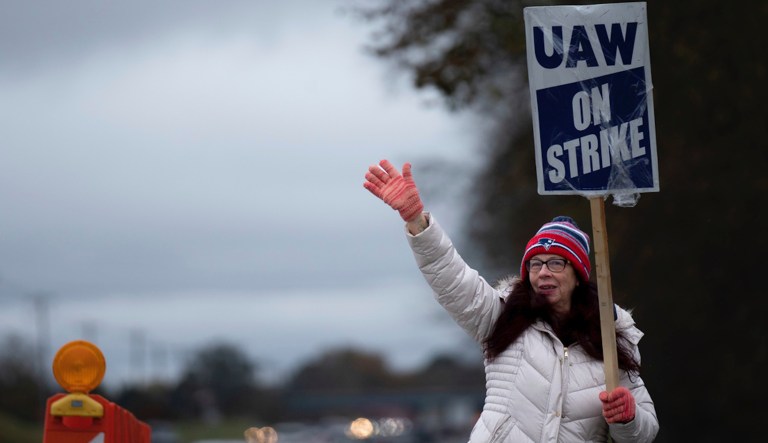 General Motors' Spring Hill union employee Mary Beth Gervais walks the picket line near the plant in Spring Hill, Tenn., Monday, Oct. 30, 2023. Gervais has worked for 37 years for GM and is walking the line for the future workers. The union and GM have reached a tentative agreement on their contracts, but will remain on the picket line until the union bosses tell them otherwise.
