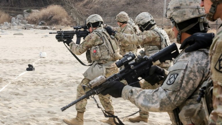 U.S. Soldiers maneuver toward their targets while conducting a range in South Korea on January 16, 2018. 