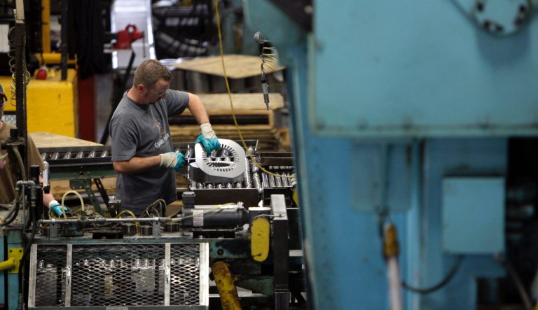 Workers at Baldor Electric Co., are seen Wednesday, June 3, 2009, in St. Louis. 