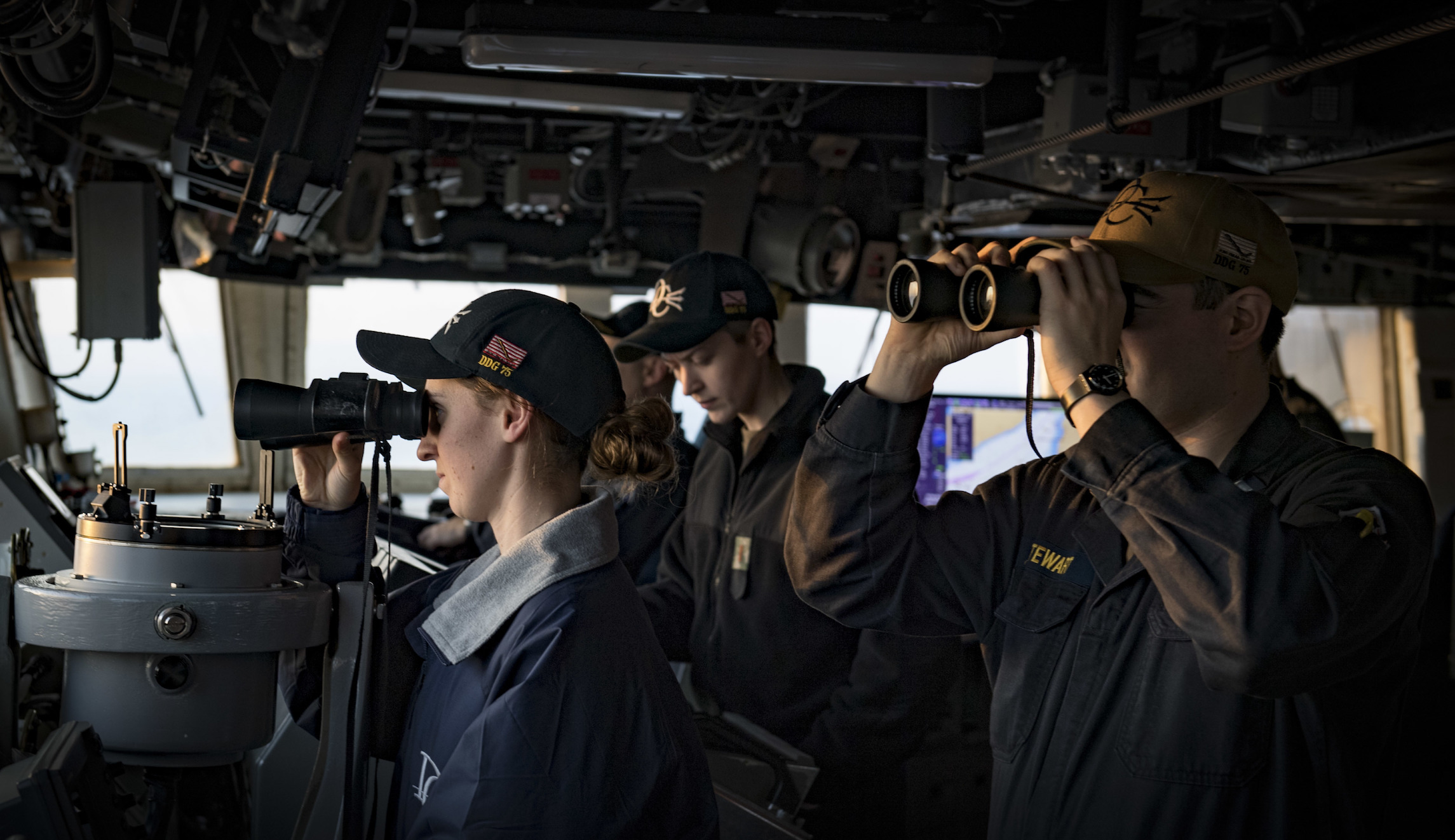 Ensign Shae Timmons, left, and Lt. j.g. Zachary Stewart stand watch aboard the Arleigh Burke-class guided-missile destroyer USS Donald Cook (DDG 75) as the ship transits the Dardanelles Strait, Feb. 19, 2019. (U.S. Navy photo by Mass Communication Specialist 2nd Class Ford Williams/Released)