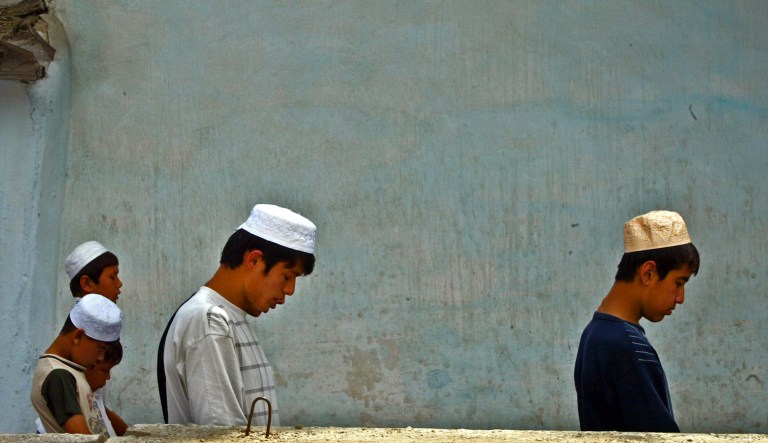 Uzbeks pray in a central mosque in Andijan, Uzbekistan Friday, May 20, 2005. Uzbek authorities shrugged off the U.N. chief's call for an international probe into a government crackdown on protesters that witnesses say killed hundreds, Secretary-General Kofi Annan said, as the country's Muslim faithful prayed Friday for an end to bloodshed.