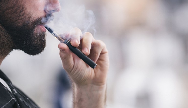 Smoking electronic cigarette.