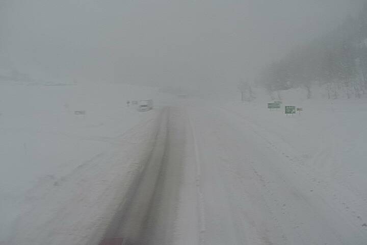 A traffic cam at lookout pass I-90 milepost 0.2 shows near whiteout conditions near the site of a reported avalanche on I-90 at the Montana/Idaho border. 
