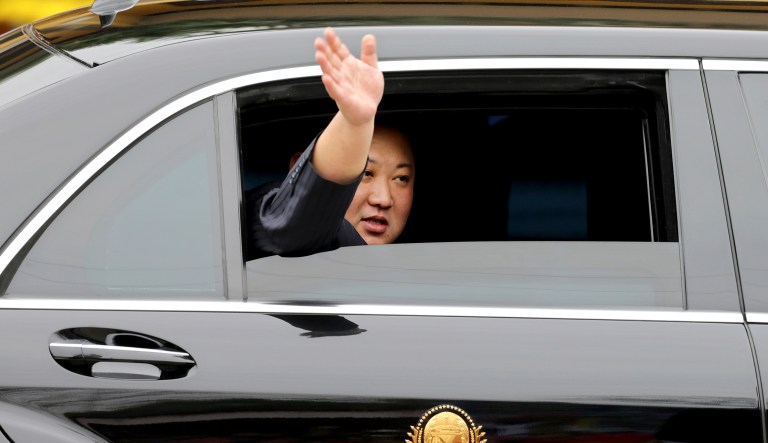 North Korean leader Kim Jong Un waves from a car after arriving by train in Dong Dang in Vietnamese border town Tuesday, Feb. 26, 2019, ahead of his second summit with U.S. President Donald Trump.