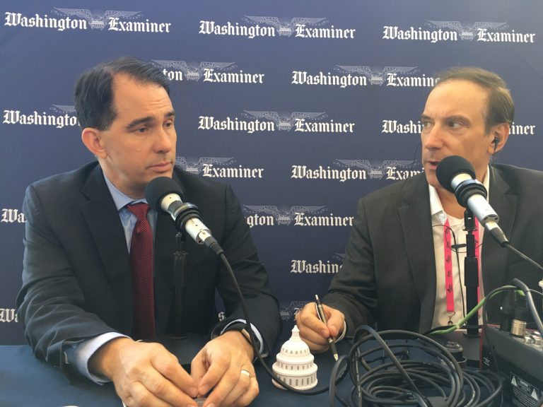 Larry O’Connor and former Gov. Scott Walker at CPAC 2019