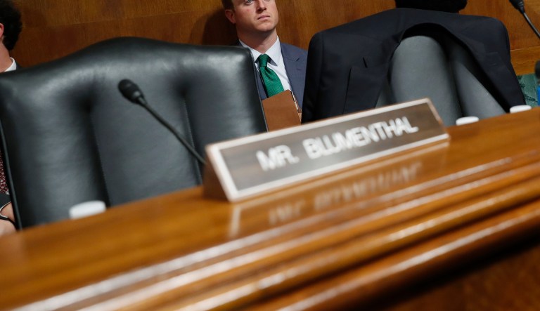 Sen. Cory Booker, D-N.J. looks past empty seats after Democratic members of the Senate Judiciary Committee walked out of the meeting, Friday, Sept. 28, 2018 on Capitol Hill in Washington.