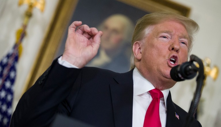 President Donald Trump speaks about the partial government shutdown, immigration and border security in the Diplomatic Reception Room of the White House, in Washington, Saturday, Jan. 19, 2019.