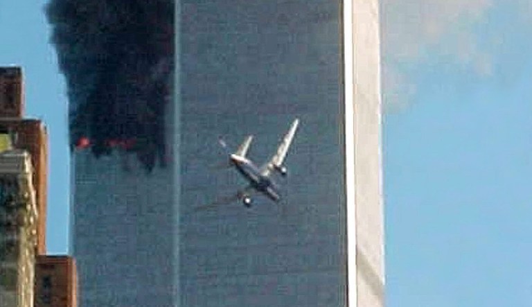 In this Sept. 11, 2001 file photo, American Airlines Flight 175 closes in on World Trade Center Tower 2 in New York, just before impact.