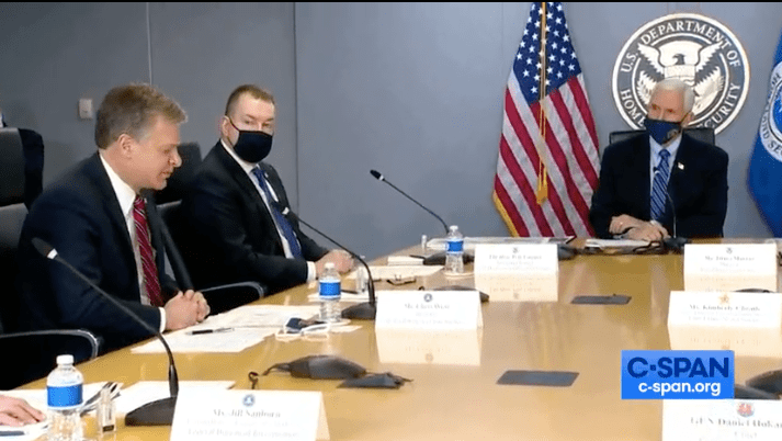 FBI Director Christopher Wray briefs Vice President Mike Pence at FEMA Headquarters.