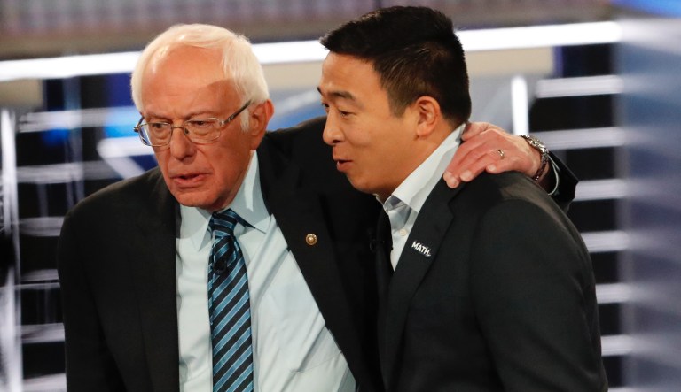 Democratic presidential candidate Sen. Bernie Sanders, I-Vt., left, speaks with Democratic presidential candidate former technology executive Andrew Yang after a Democratic presidential primary debate, Wednesday, Nov. 20, 2019, in Atlanta.
