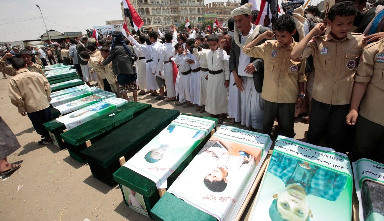 Yemeni people attend the funeral of victims of a Saudi-led airstrike, in Saada, Yemen, Monday, Aug. 13, 2018. Yemen's shiite rebels are backing a United Nations' call for an investigation into the airstrike in the country's north that killed dozens of people including many children.