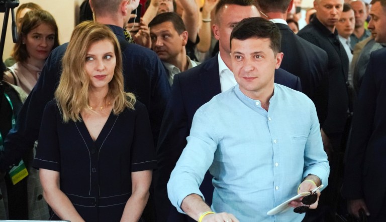 Ukrainian President Volodymyr Zelenskiy, right, and his wife Olena Zelenska cast their ballots at a polling station during a parliamentary election in Kiev, Ukraine, Sunday, July 21, 2019. Ukrainians are voting in an early parliamentary election in which the new party of President Volodymyr Zelenskiy is set to take the largest share of votes.
