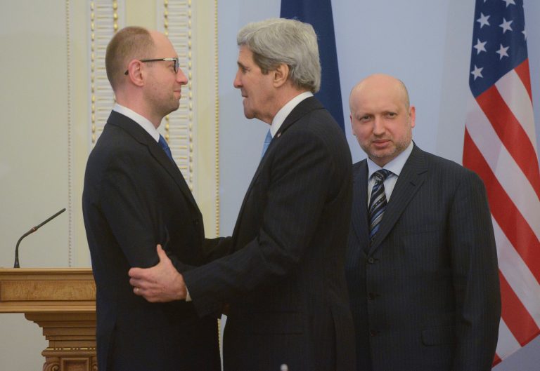 In Kiev, Kerry visits protest sites, promises aid