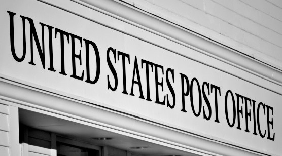 Updated: Postal service officials see no conflicts when its top real estate agent also represents buyers
