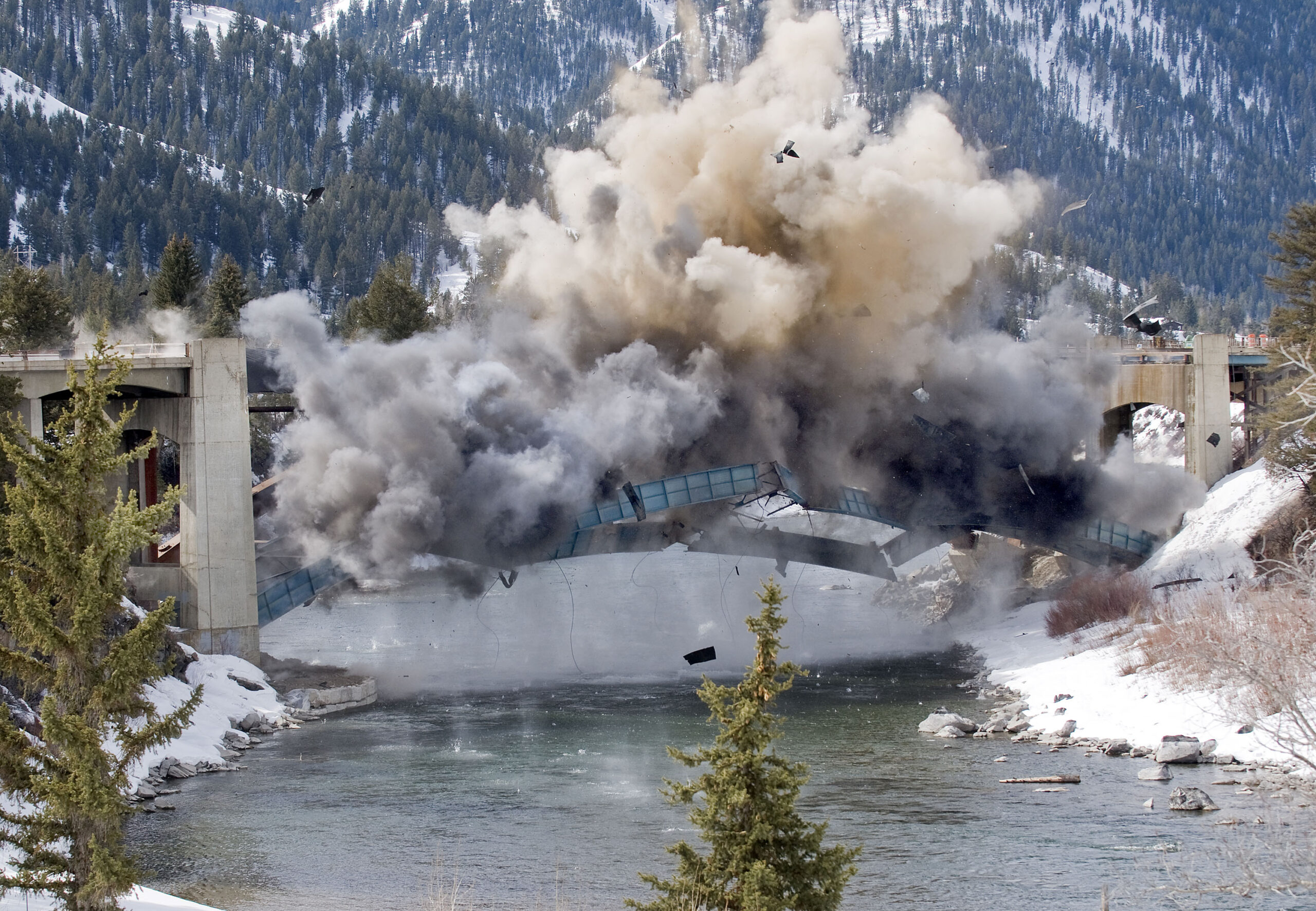 Explosives bring down bridge arches at Hoback