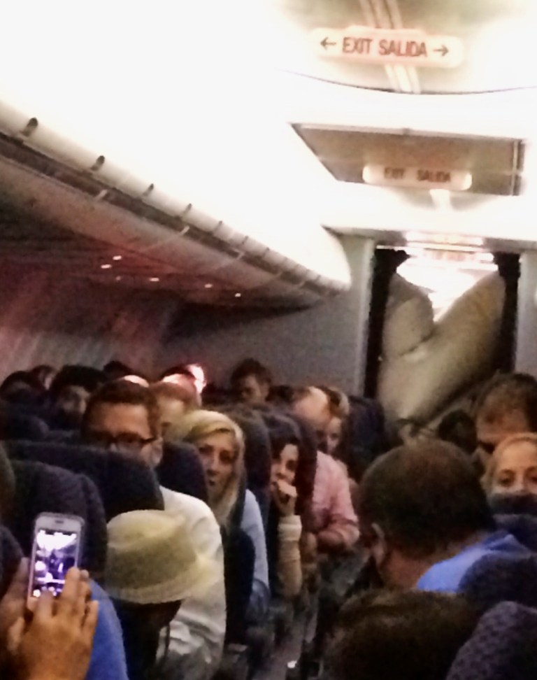 United plane’s evacuation slide deploys mid-flight