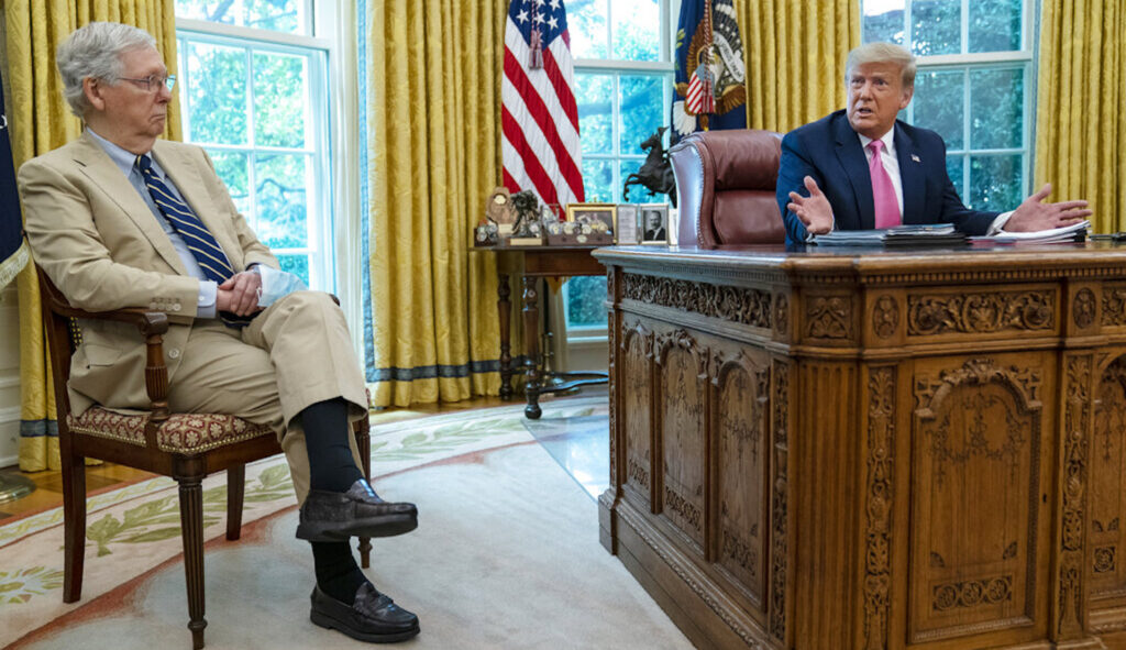 Senate Majority Leader Mitch McConnell (R-KY) listens as President Donald Trump speaks during a meeting in the Oval Office of the White House, July 20, 2020, in Washington. (AP Photo/Evan Vucci, File)
