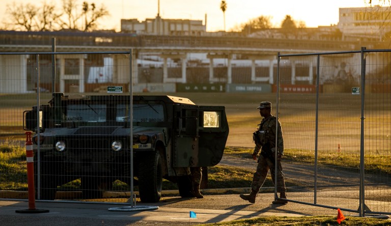 Texas Department of Public Safety officers guard an entrance to Shelby Park on Thursday, Jan. 11, 2024, in Eagle Pass, Texas. The Justice Department on Friday, Jan. 12, asked the Supreme Court to order Texas to stop blocking Border Patrol agents from a portion of the U.S.-Mexico border where large numbers of migrants have crossed in recent months, setting up another showdown between Republican Gov. Greg Abbott and the Biden administration over immigration enforcement. (Sam Owens /The San Antonio Express-News via AP)