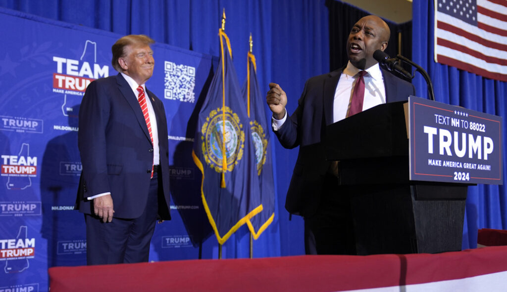 Sen. Tim Scott (R-SC) speaks alongside former President Donald Trump at a campaign event in Concord, N.H., Friday, Jan. 19, 2024. (AP Photo/Matt Rourke)