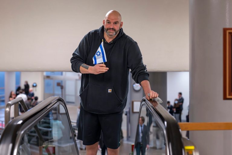 John Fetterman greets protesters outside his home by waving Israeli flag