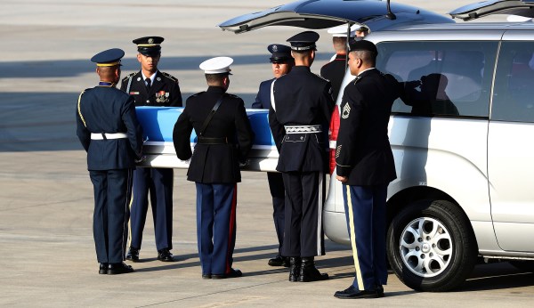 Presumed US war remains handed over by North Korea begin journey home after ceremony in South Korea