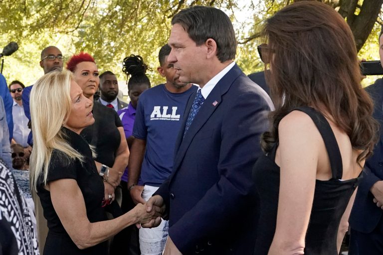Jacksonville Mayor Donna Deegan, left, greets Florida Gov. Ron DeSantis, center and his wife Casey, right, before a prayer vigil for the victims of Saturday's mass shooting Sunday, Aug. 27, 2023, in Jacksonville, Fla.
