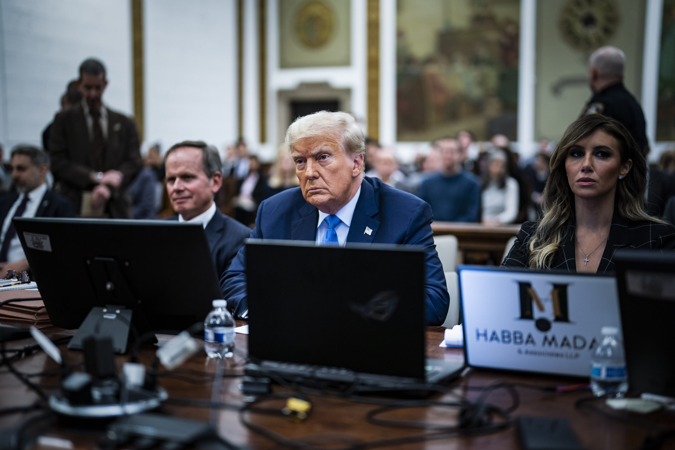 Trump defends business empire during hours of heated testimony