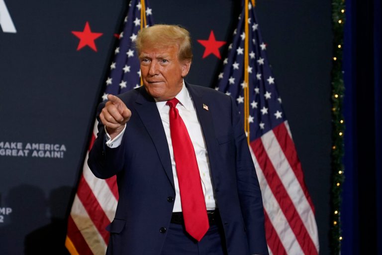 Former President Donald Trump greets supporters as he arrives at a commit to caucus rally, Tuesday, Dec. 19, 2023, in Waterloo, Iowa. 